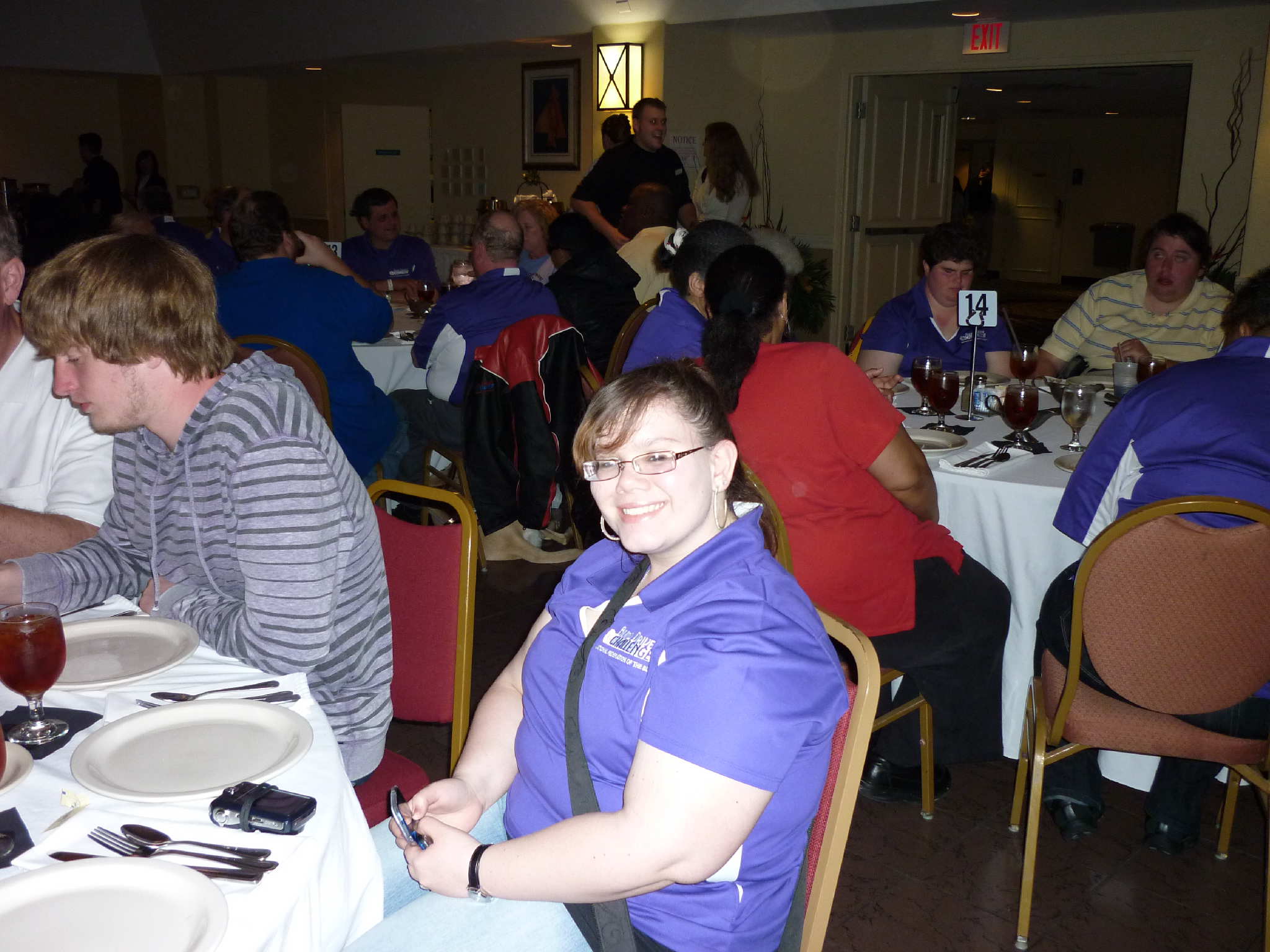 Angela Dehart sitting down at banquet